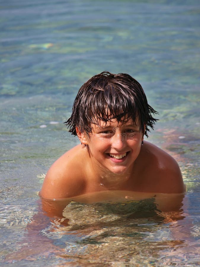 Wet boy at sea. Teenager enjoying at Adriatic sea (Croatia-Dalmatia royalty free stock image
