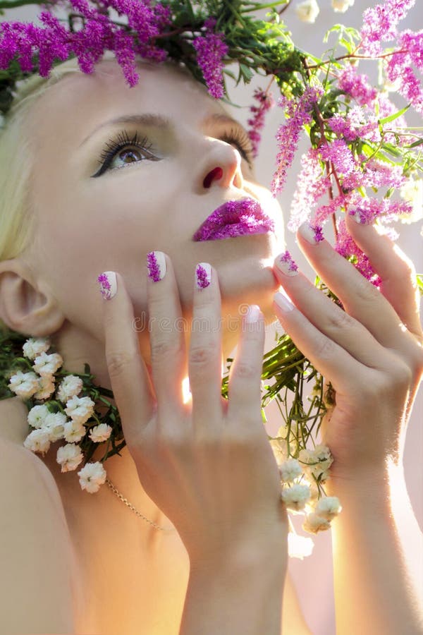 White pink manicure and makeup. stock image