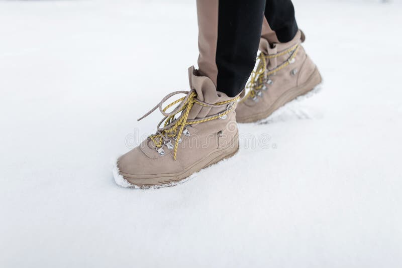 Winter leather stylish woman`s boots with yellow laces. Female fashion. Stylish shoes. Close-up. Winter leather stylish woman`s boots with yellow laces. Female royalty free stock photography