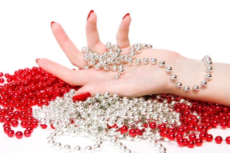 Woman hand with red and silver glassbeads stock photography
