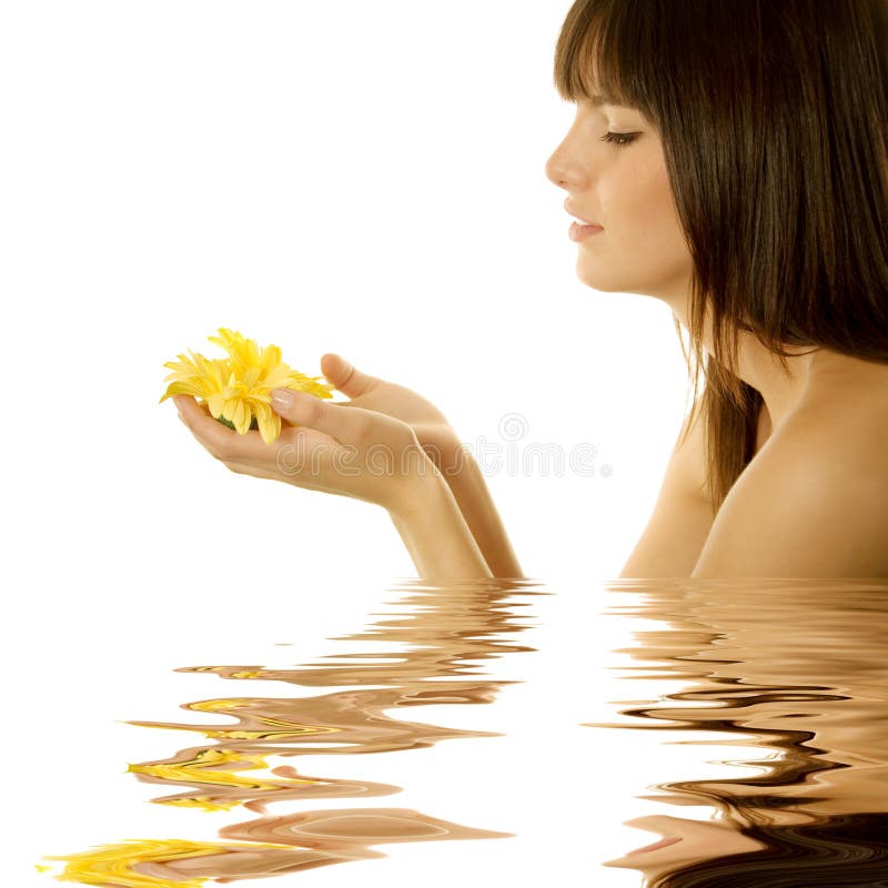 Woman holding a daisy. Woman holding a yellow daisy stock photos