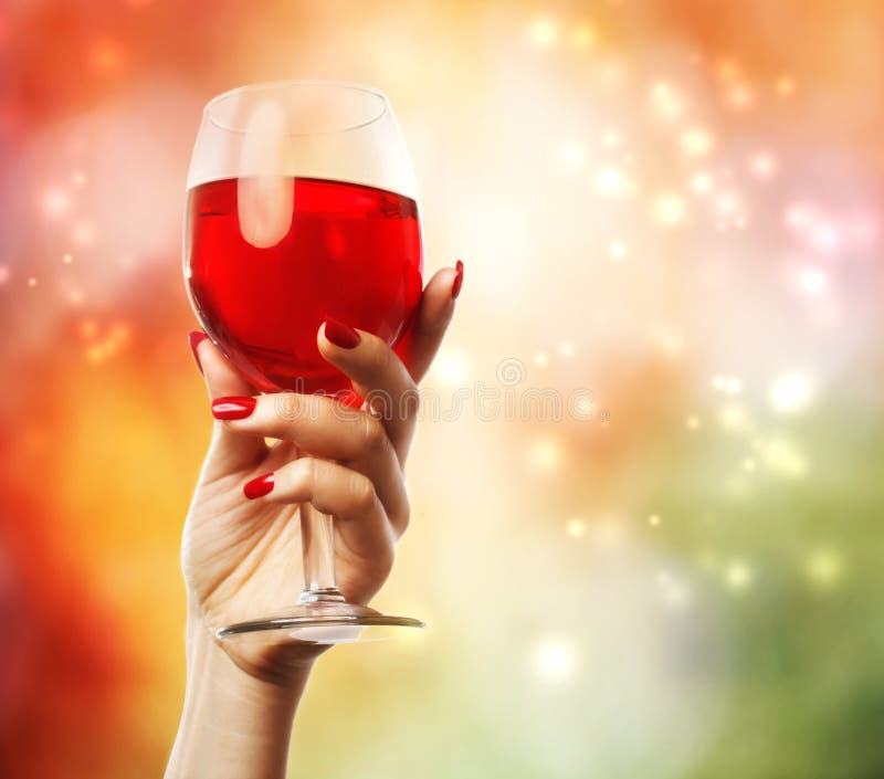 Woman holding a wine glass stock photography