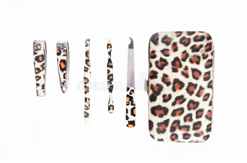 Women`s manicure set/kit with leopard skin design on it. Top view of multiple hygiene tools and case stock image