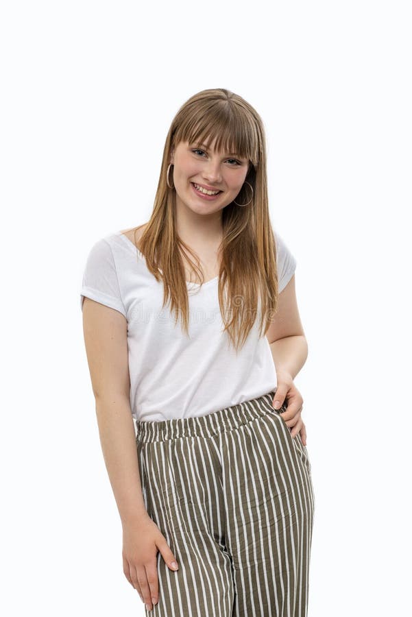 Young girl with long blonde hair with a bang, isolated. Half length portrait of a young girl with long blonde hair with a bang wearing  white shirt and striped stock image