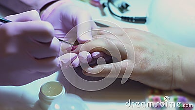 Nail stylist making glitter design by brush, manicure customer service, art stock video