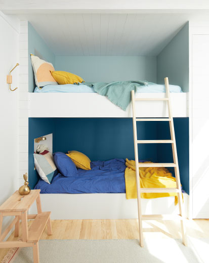 A bunk bed alcove with two-tone blue walls A bunk bed alcove with two-tone blue walls