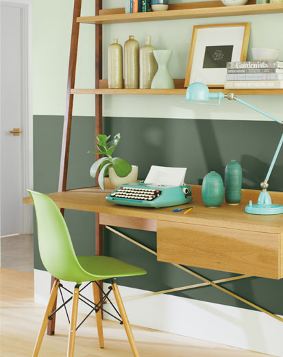 A two-tone green home office wall with green office chair A two-tone green home office wall with green office chair