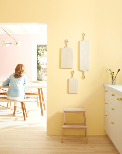 A light kitchen with pale yellow walls and white-painted cabinets A light kitchen with pale yellow walls and white-painted cabinets
