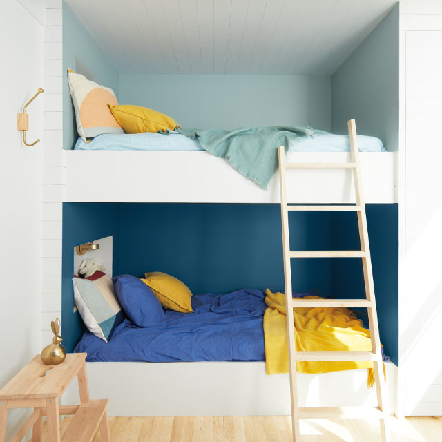 A bunk bed alcove with two-tone blue walls A bunk bed alcove with two-tone blue walls