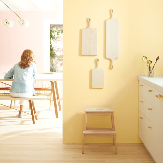 A light kitchen with pale yellow walls and white-painted cabinets A light kitchen with pale yellow walls and white-painted cabinets