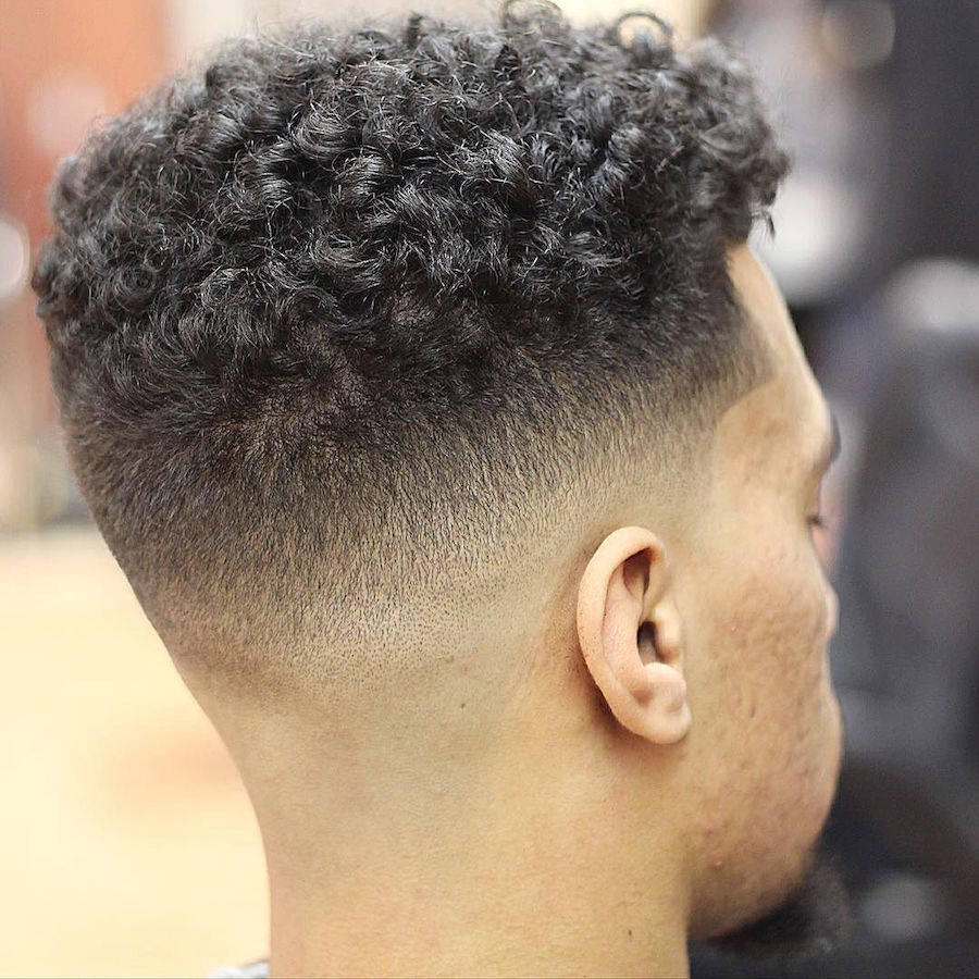 barberjuan94_and mid skin fade and curly hair on top